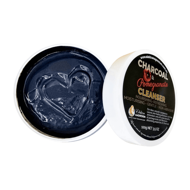 Open container of charcoal-based cleanser with visible branding 