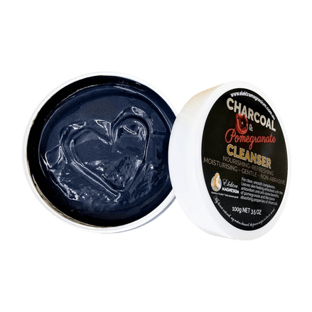 Open container of charcoal-based cleanser with visible branding 