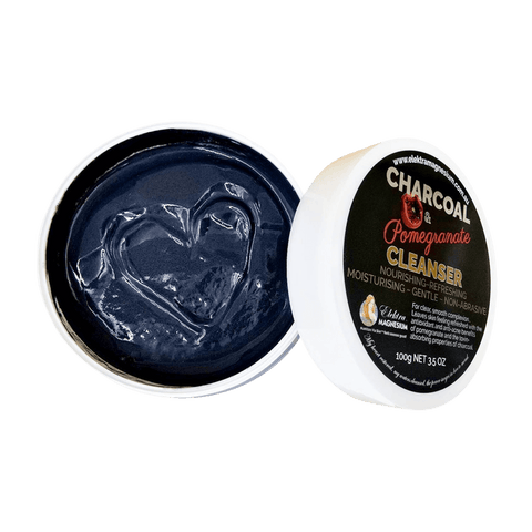Open container of charcoal-based cleanser with visible branding 